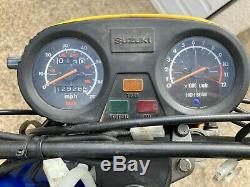 Classic 1986 Yellow Suzuki TS50X motorcycle 50cc
